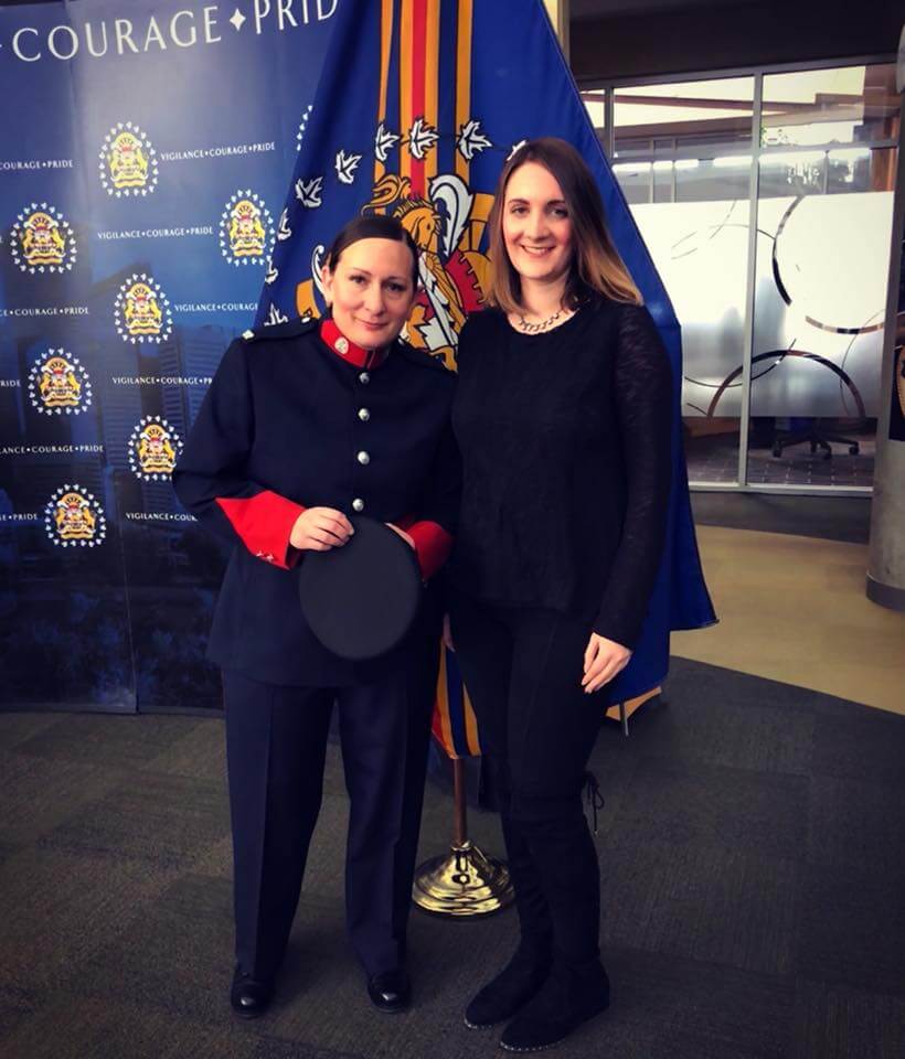 Jenn Galandy at the Calgary Police Life Saving Awards Ceremony with an award winning police officer: February 2018 in Calgary, Canada